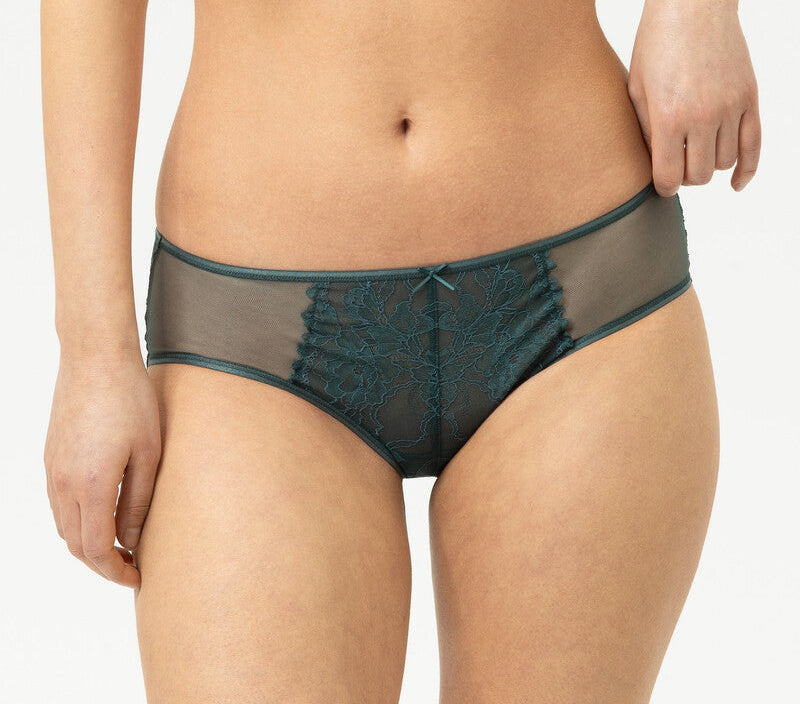 Teal lace lingerie set on a white background