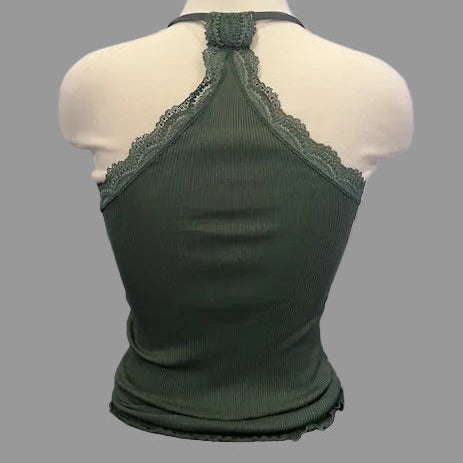 Green lace-trimmed top on a mannequin against a neutral background