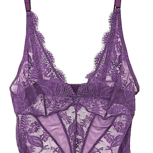 A purple lace thong bodysuit with adjustable straps and intricate floral patterns.