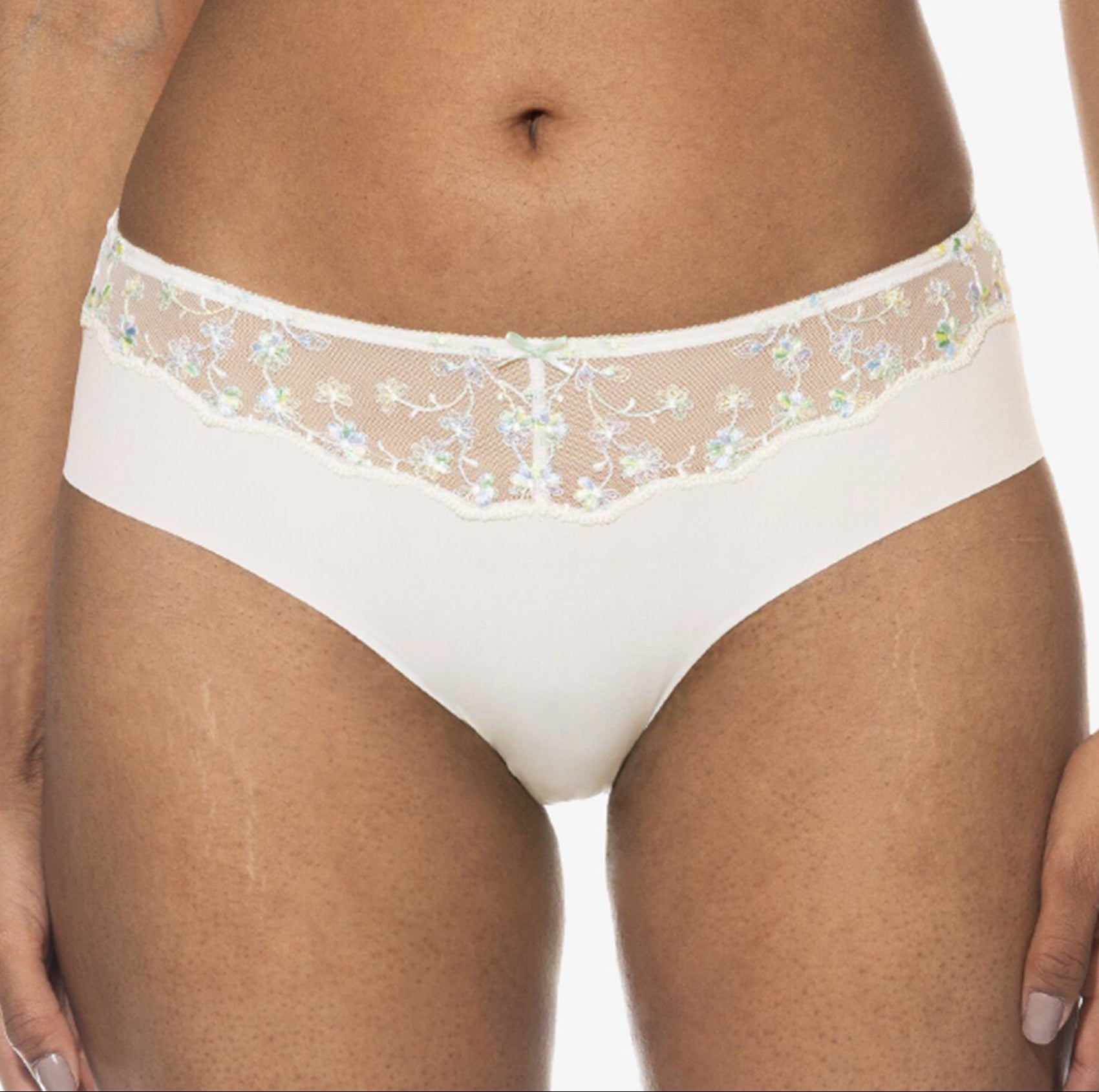 White lace-trimmed underwear on a white background
