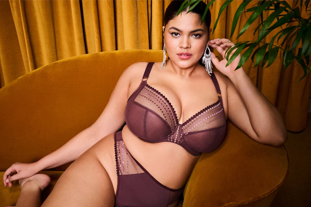 a full busted woman enjoys the comfort of a comfortable bra that matches her skin tone