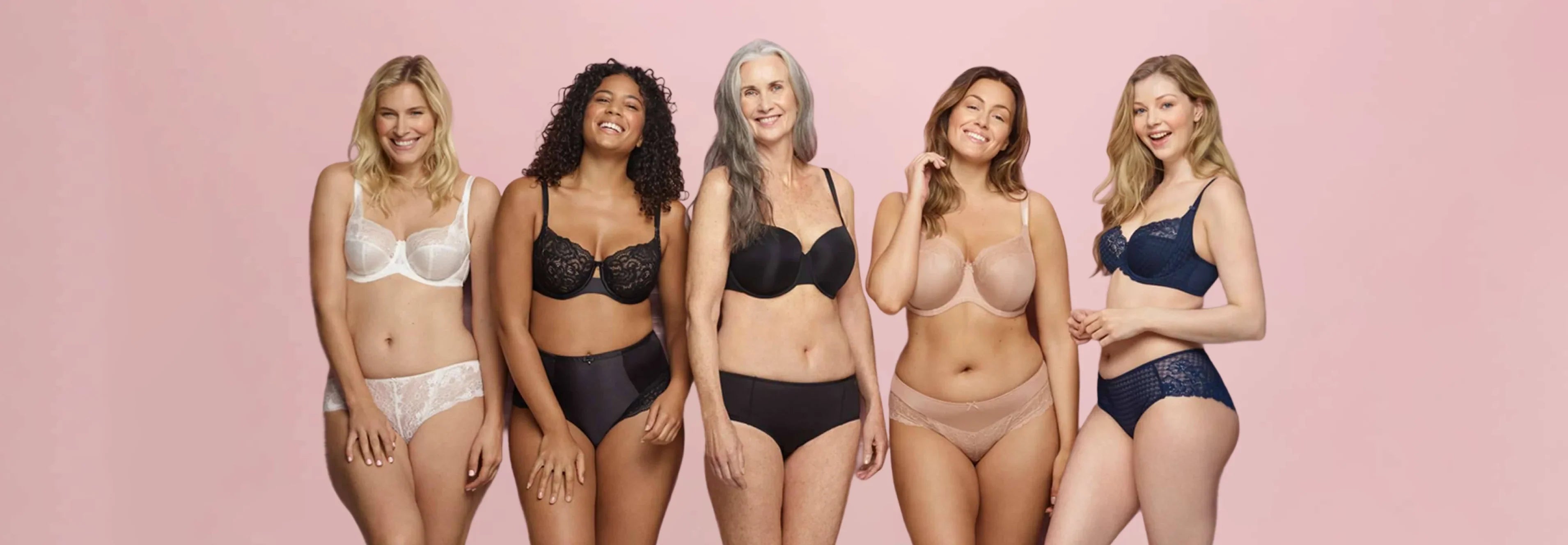 a full-busted woman smiles confidently wearing a French bra that fits perfectly
