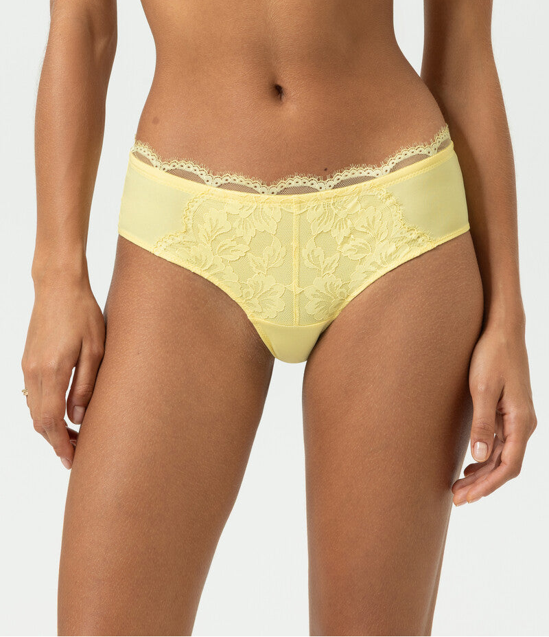 Yellow lace lingerie set on a plain background
