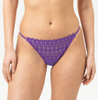 Purple lace bikini set on a plain background