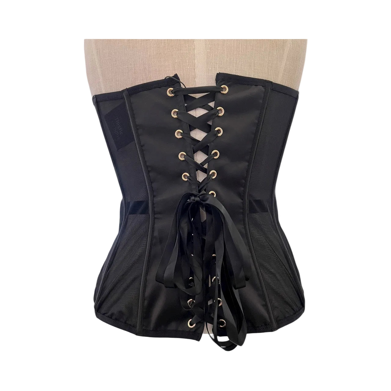 Black corset on a mannequin against a white background