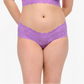 Woman wearing a purple lingerie set on a white background