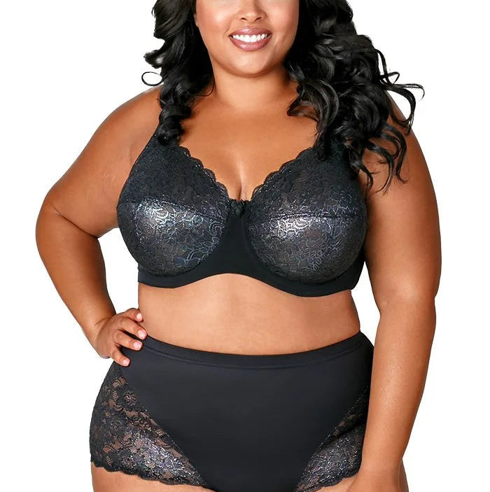 Woman wearing a black lace lingerie set on a white background