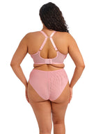 Person wearing a pink bikini set on a white background