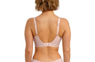 Woman wearing a pink bikini set on a white background