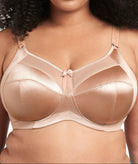 Woman wearing a beige bra with a neutral background