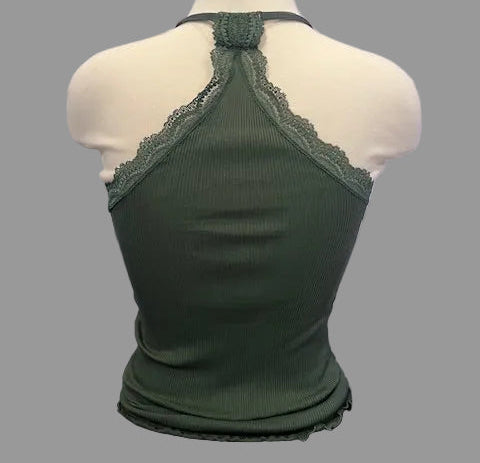 Green lace-trimmed top on a mannequin against a neutral background