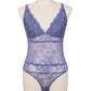 Blue lace bodysuit on a mannequin against a gray background