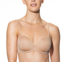Woman wearing a beige bra on a white background