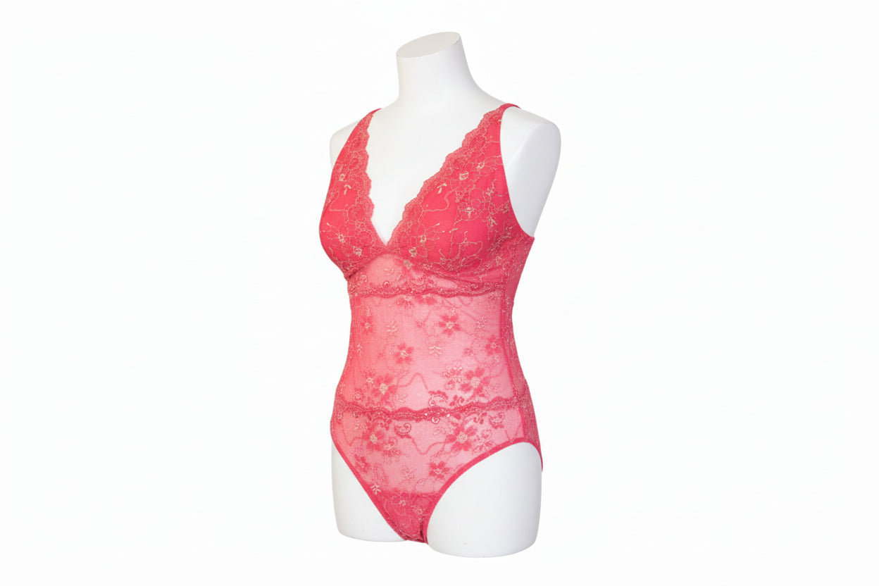 Pink lace lingerie set on a mannequin against a white background
