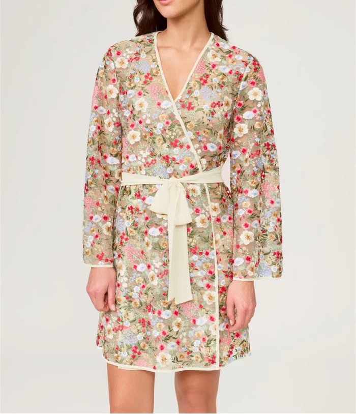 Woman wearing a floral dress with a white background