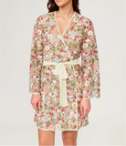Woman wearing a floral dress with a white background