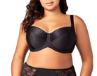 Woman wearing a black bra and lace underwear set on a white background